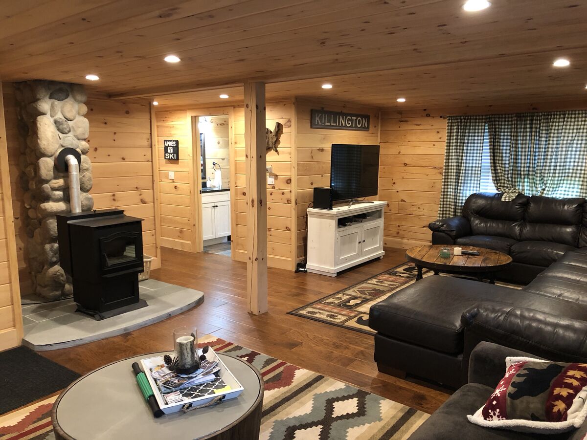 The Living Room with Fireplace and TV of our Killington, VT Cabin Rentals.