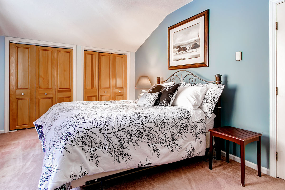 Bedroom with Large Bed in One of Our Killington VT House Rentals.