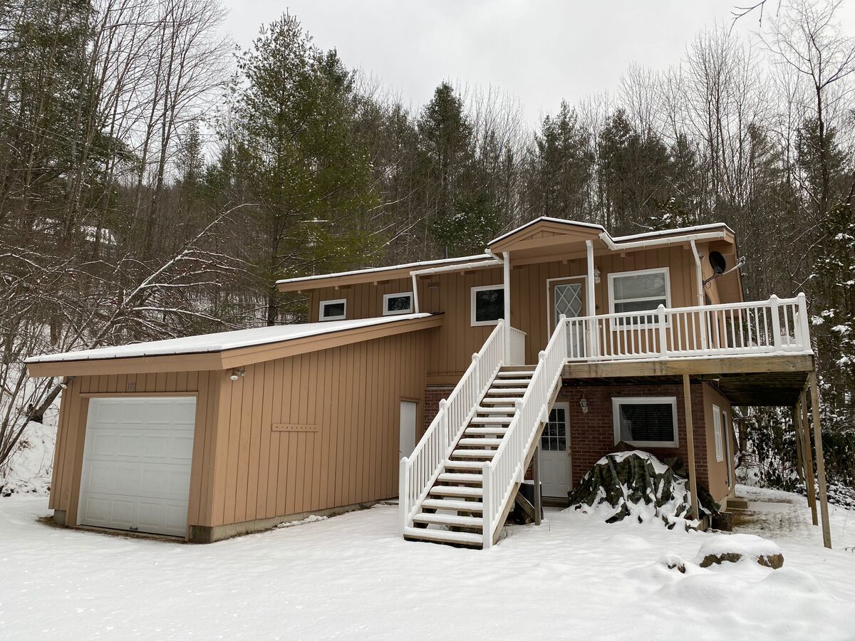 Front Picture of one of our Killington Vacation Homes with Snow.