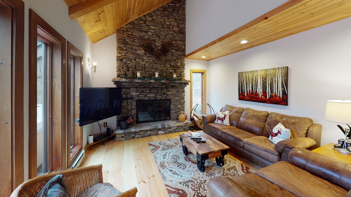 The Living Room with Fireplace and TV of One of Our Month to Month Vacation Rentals.