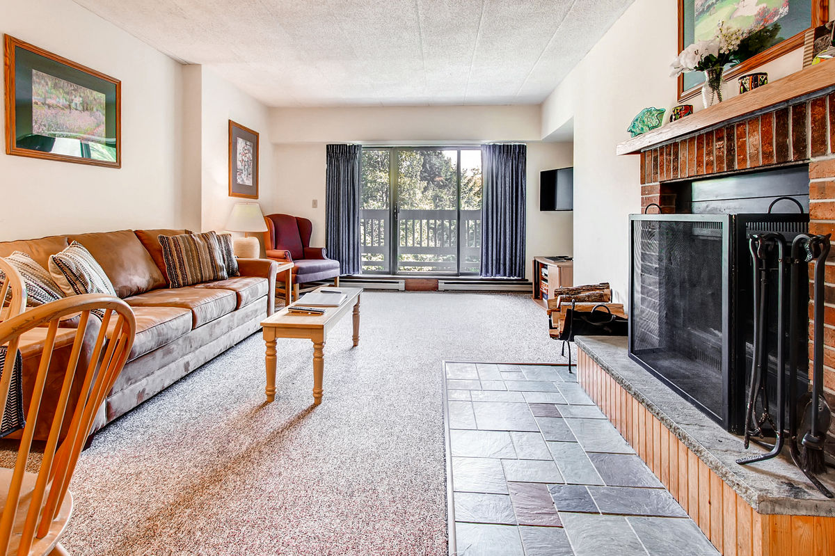 Living Room with Fireplace in One of our 3-Bedroom Flat Vacation Rentals in Killington.
