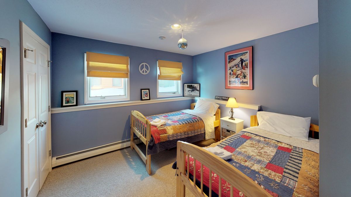 Bedroom with Two Beds in one of our Killington Vacation Homes.