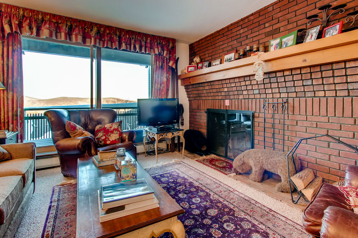 The Living Room with Fireplace and TV of One of Our Killington Holiday Rentals.