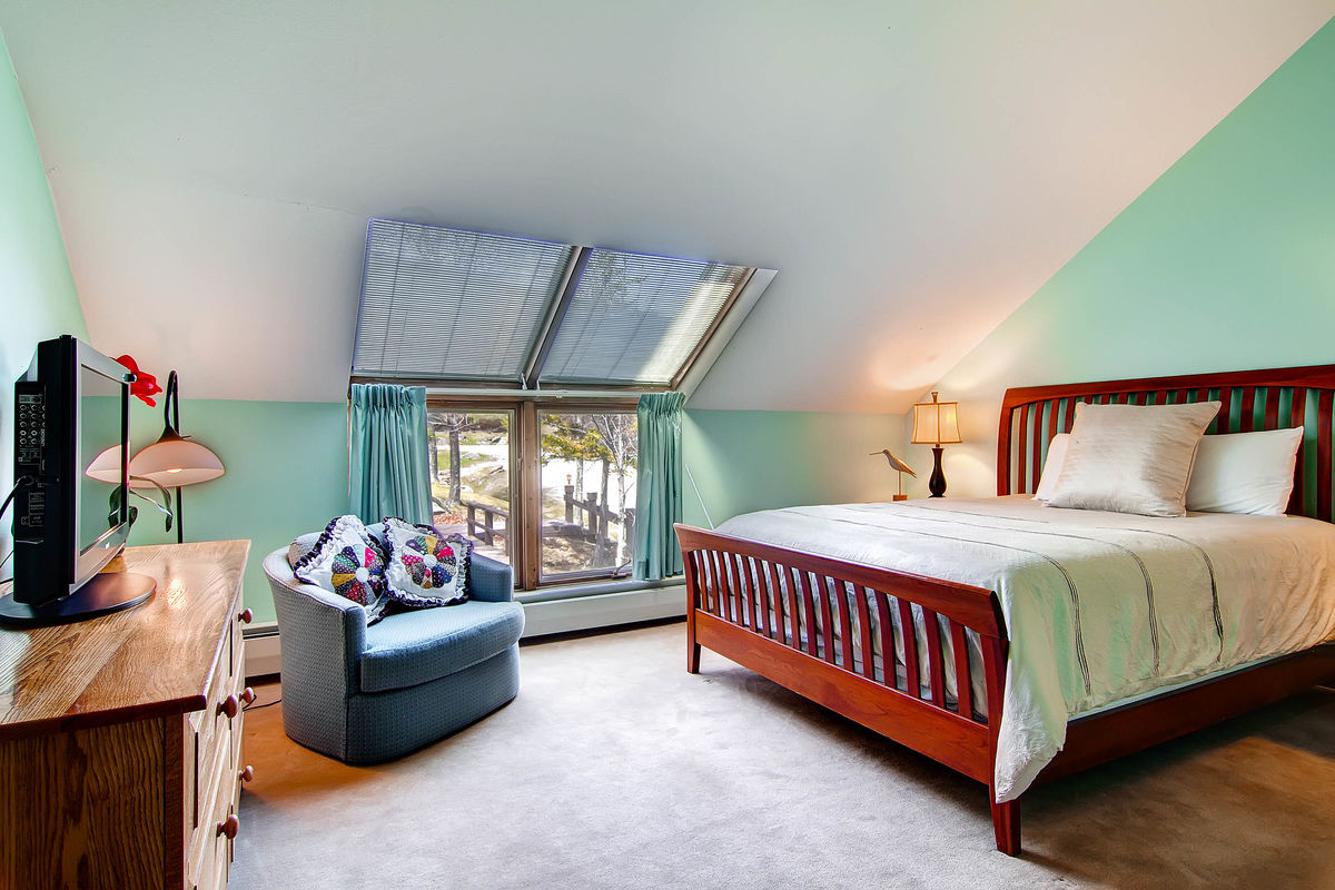 Bedroom with Large Bed in One of Our Killington VT Pet-Friendly Condos.