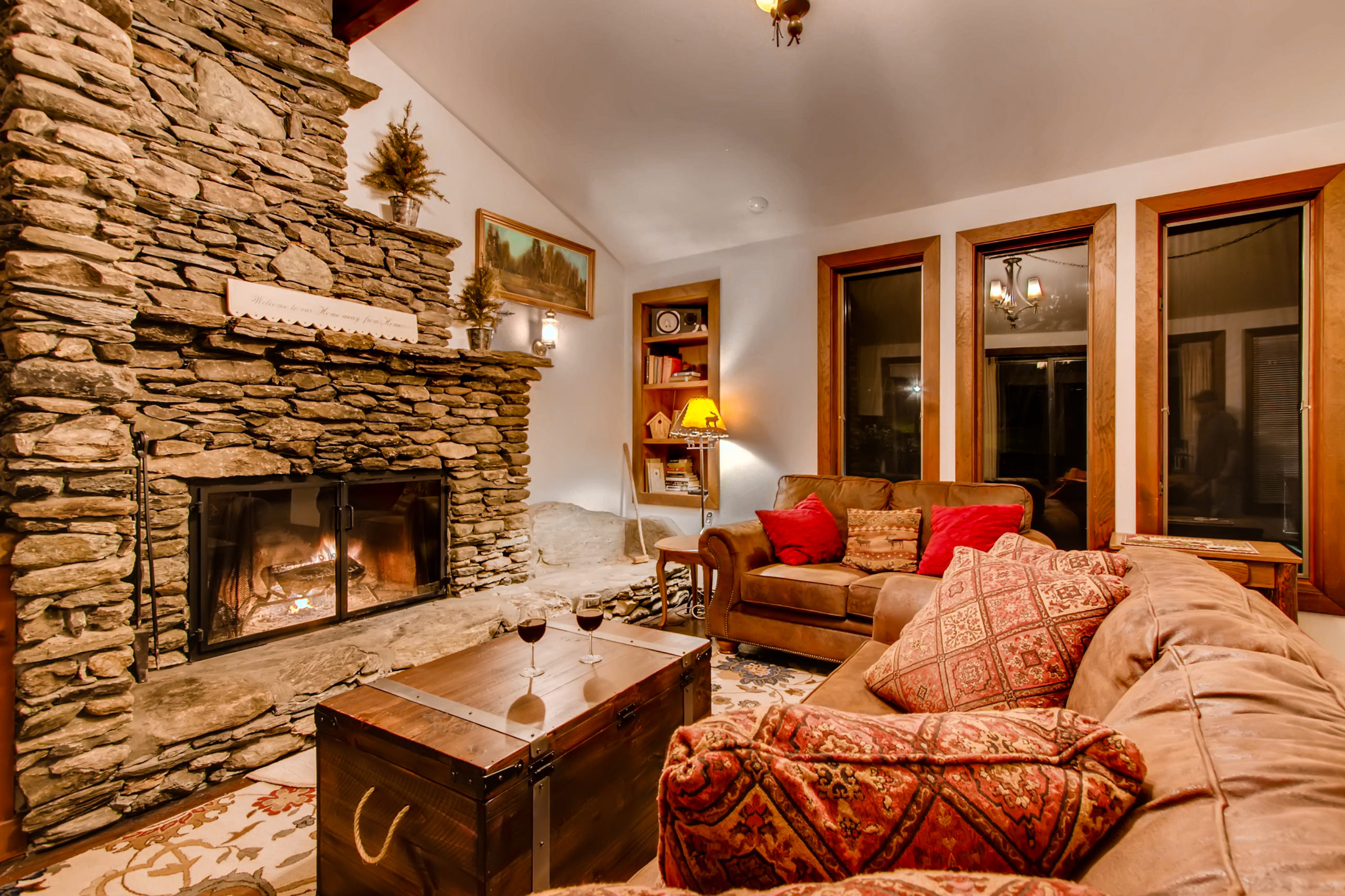 The Living Room with Fireplace of One of Our Killington Vacation Rentals by Bedroom.