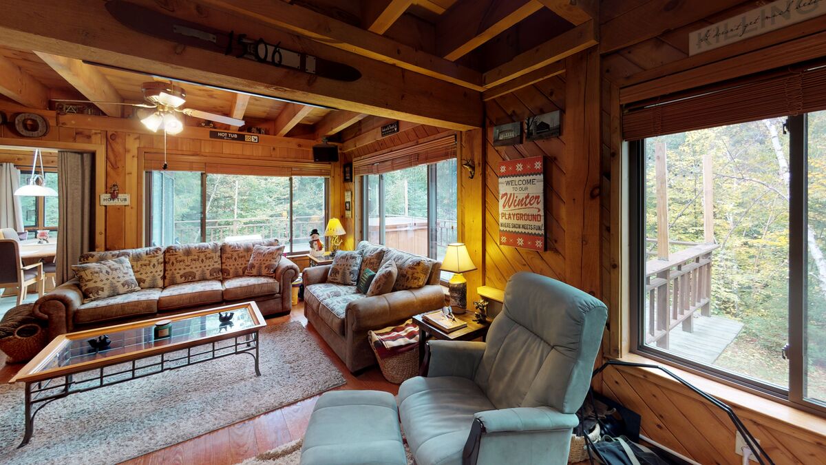 Living Room with Mountain Views in One of Our Online School Rentals in Killington.